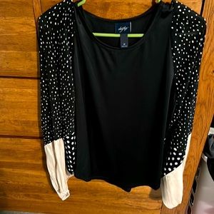 Daytrip shirt. Black and gold and with white polka dots.